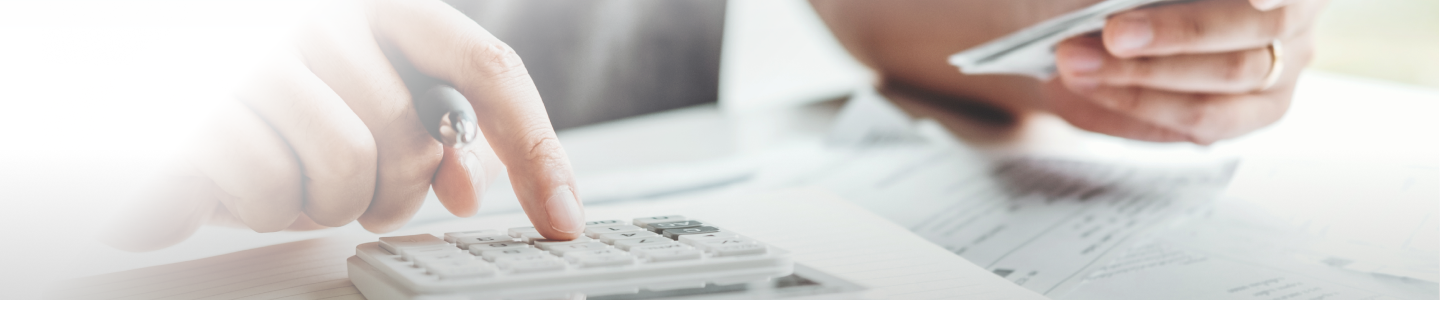 Man using calculator to calculate finances.